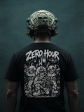 Person wearing a black t-shirt with 'Zero Hour' graphic design and a helmet on a dark background