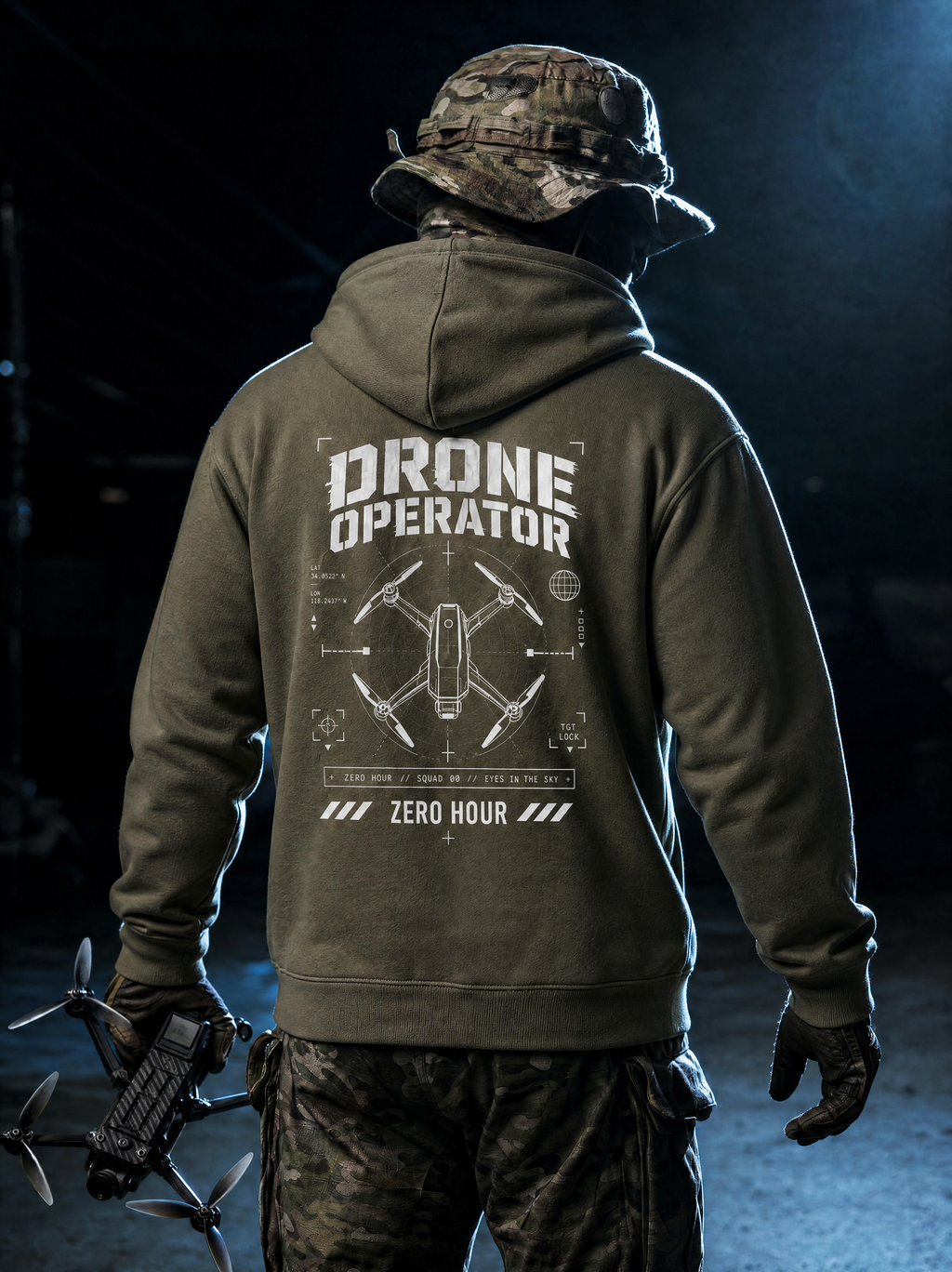Person wearing a hoodie with 'Drone Operator' text and drone graphic, holding a drone in a dark setting.