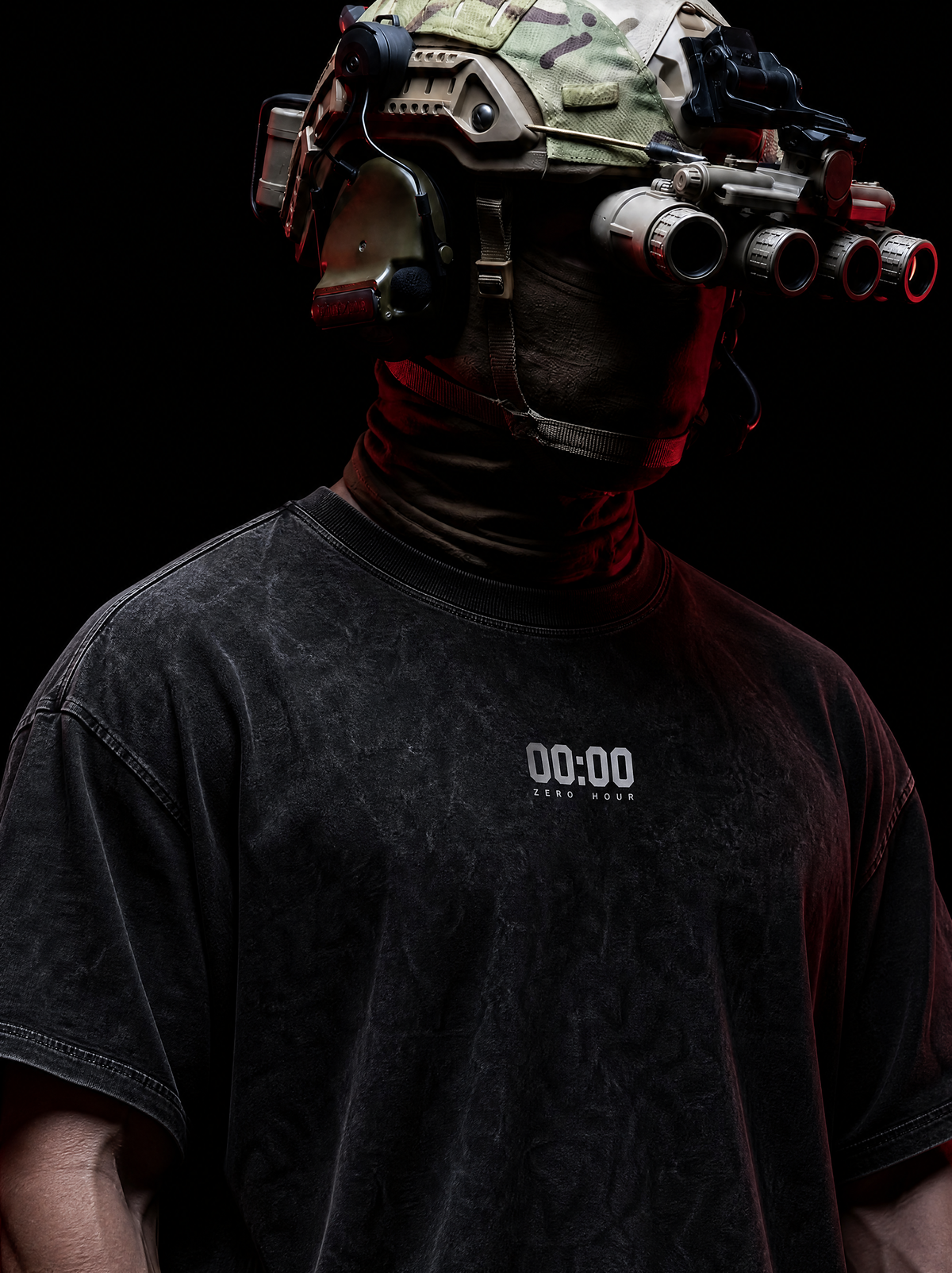A person in tactical gear wearing a black distressed t-shirt with '00:00' printed on the chest, set against a solid black background.