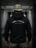 Person wearing a black hoodie with text on the back, standing in an indoor setting.