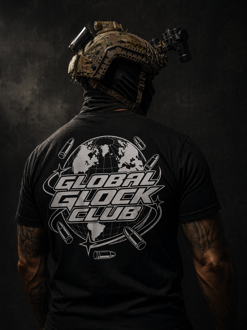 A man viewed from behind wearing a black t-shirt with a large white 'GLOBAL GLOCK CLUB' graphic on the back, paired with a tactical helmet and night vision goggles, against a dark textured background.