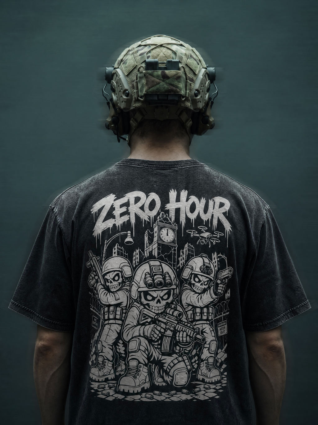 Person wearing a black t-shirt with graphic design and text, standing against a dark background