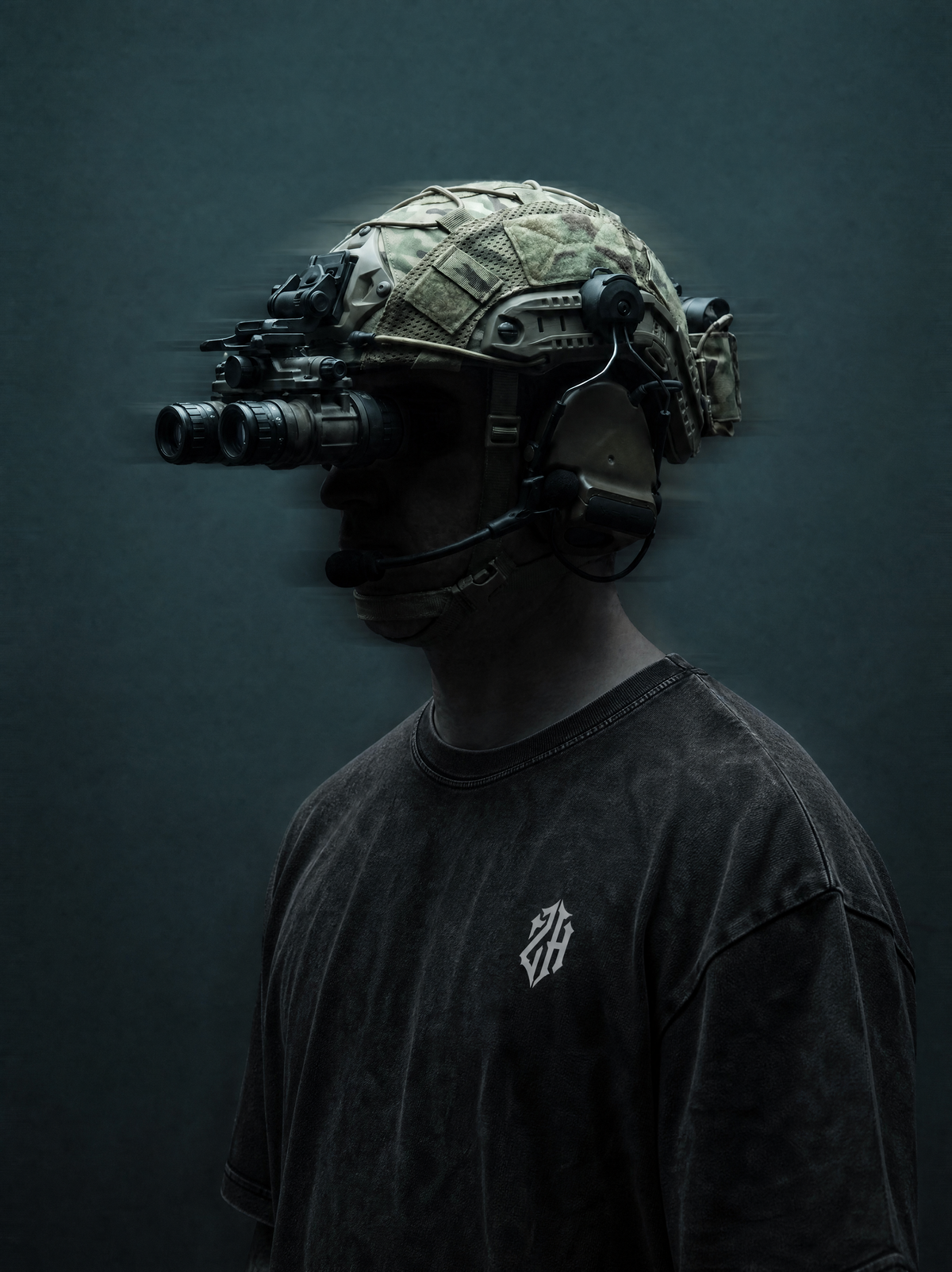 Person wearing a tactical helmet with night vision goggles on a dark background