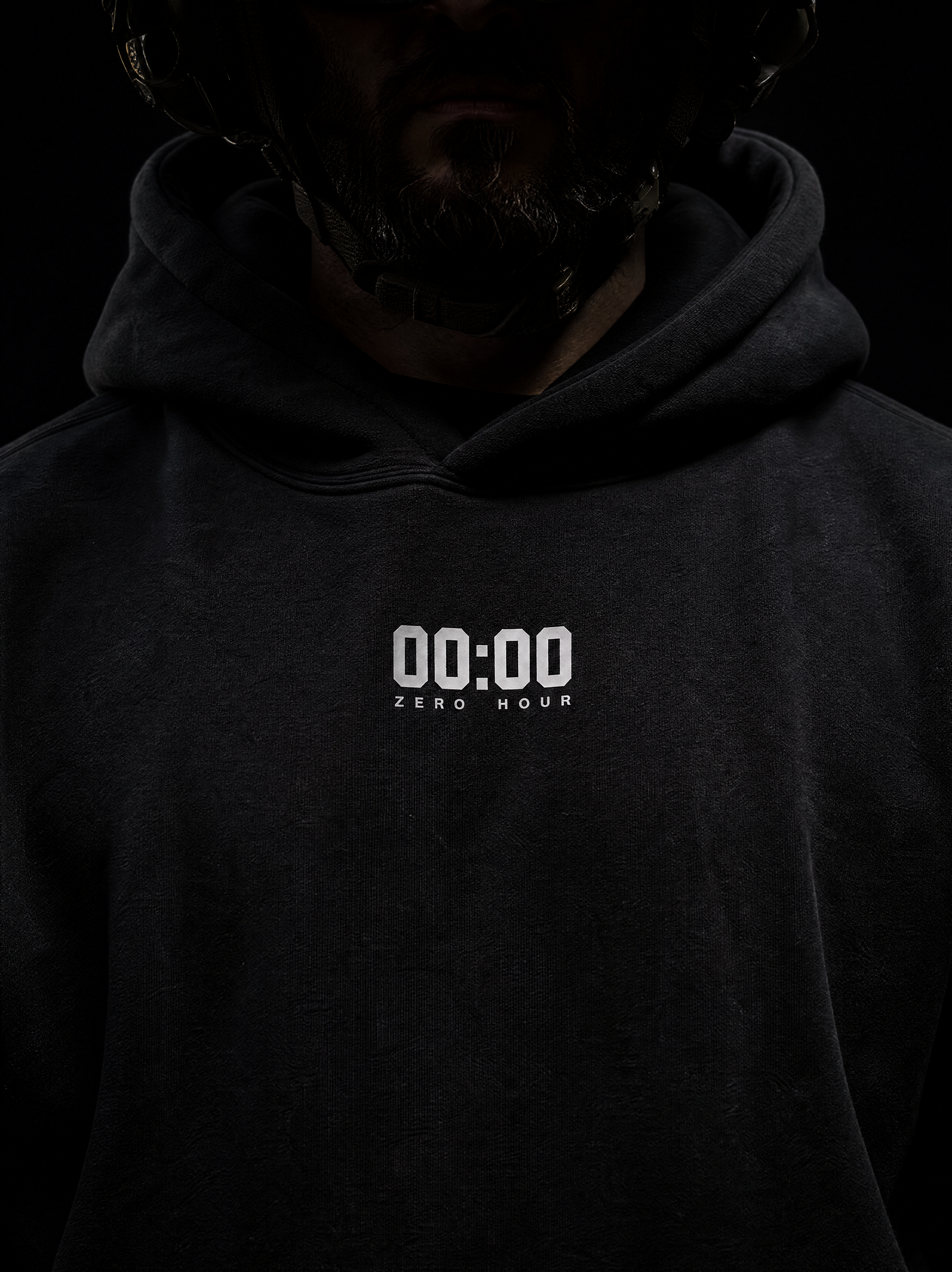 Dark hoodie with '00:00 ZERO HOUR' text on a black background