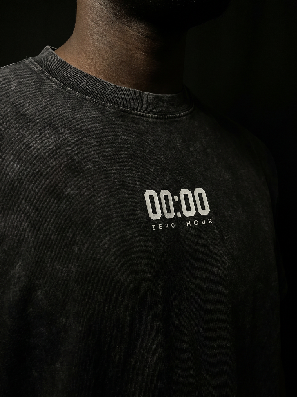 Black t-shirt with '00:00 Zero Hour' text on a dark background