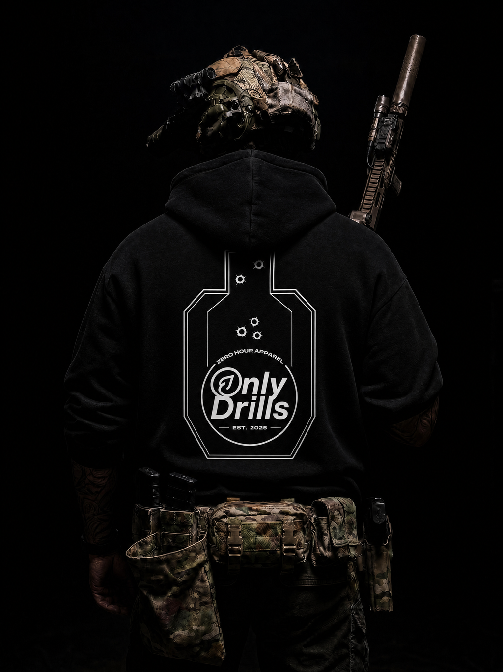 Person wearing a black hoodie with 'Only Drills' logo and camouflage gear on a dark background