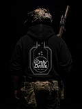 Person wearing a black hoodie with 'Only Drills' logo and camouflage gear on a dark background