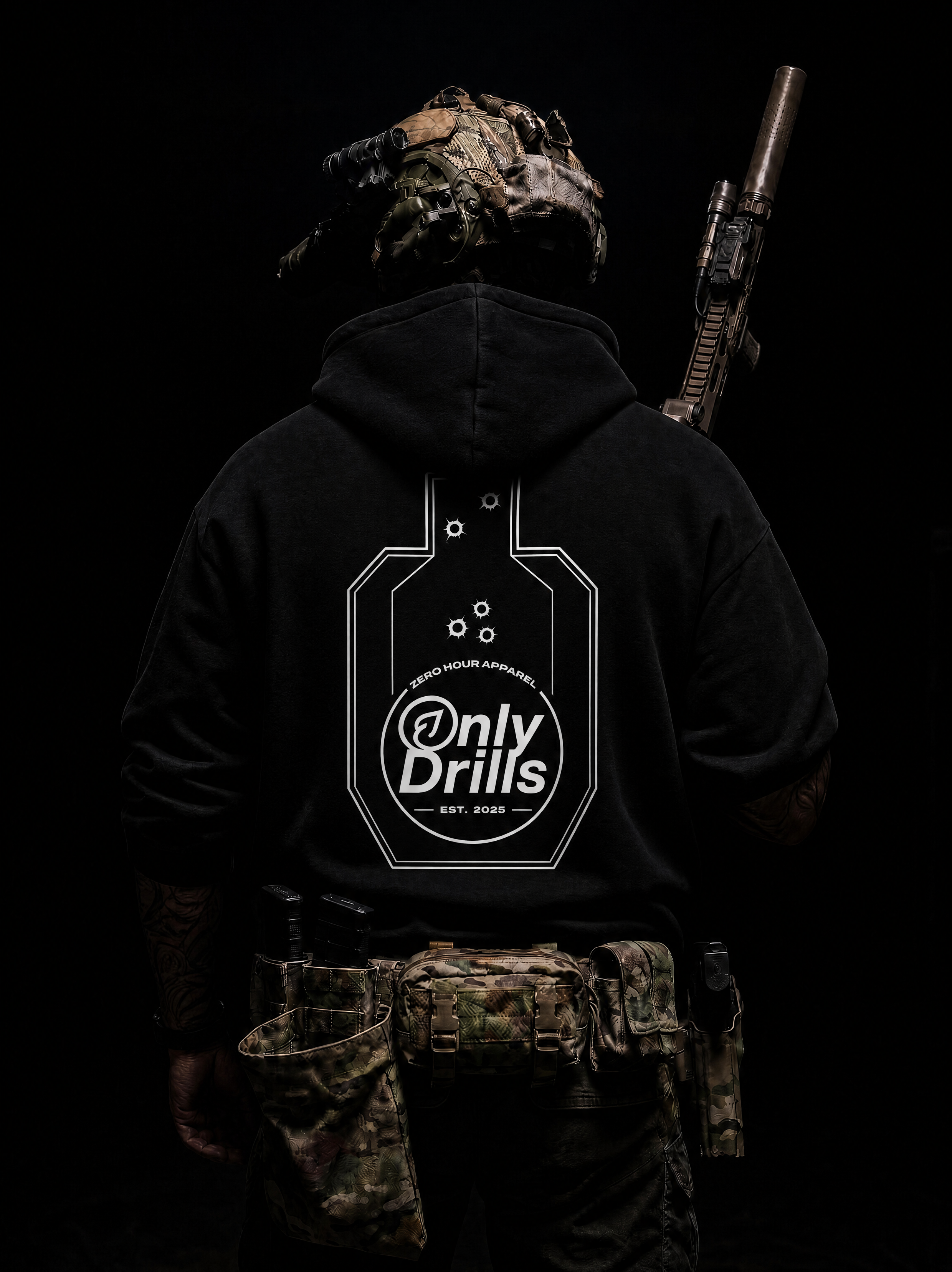 Person wearing a black hoodie with 'Only Drills' logo and camouflage gear on a dark background