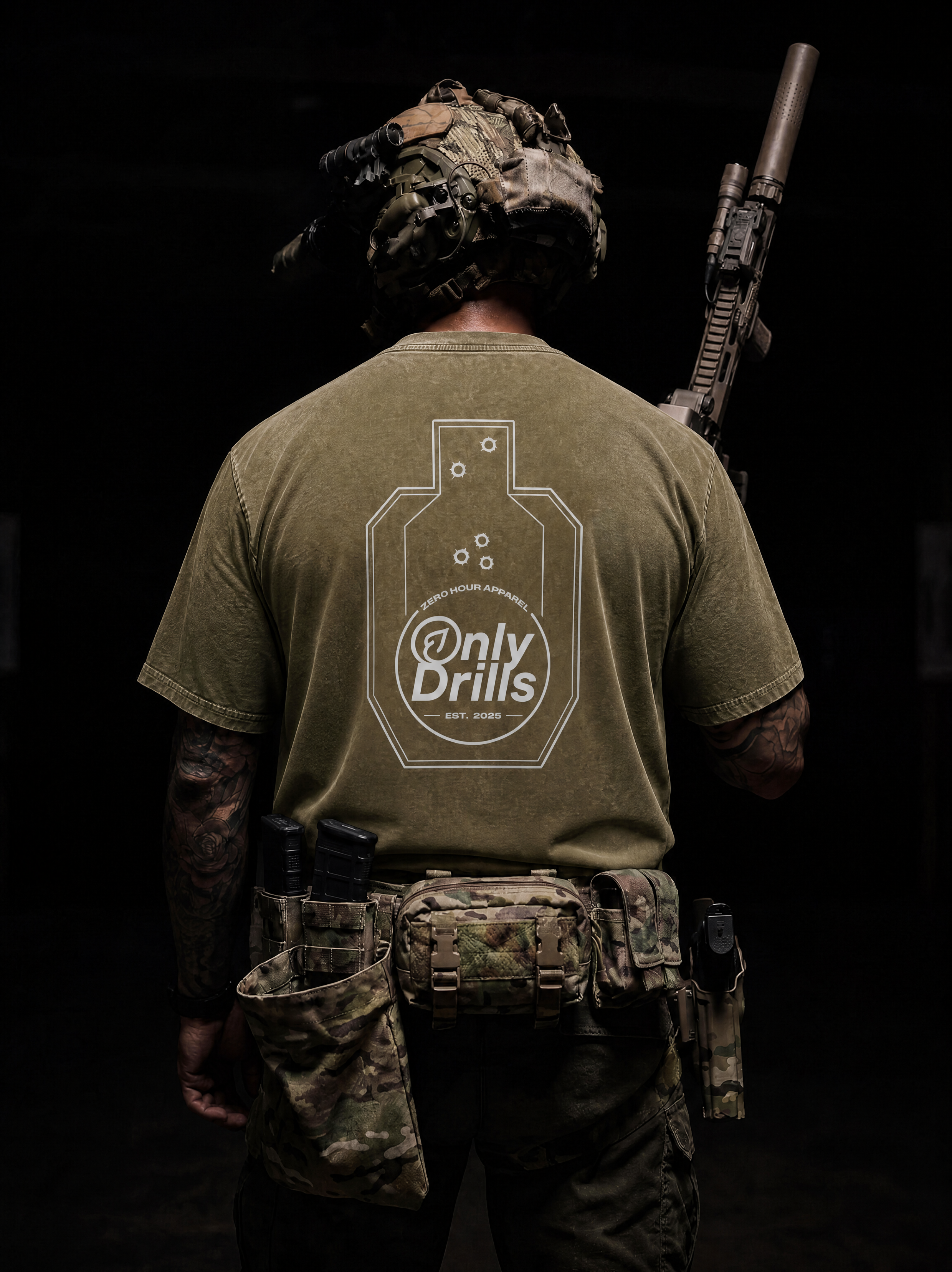 Person wearing a green t-shirt with 'Only Drills' logo, holding a rifle on a dark background
