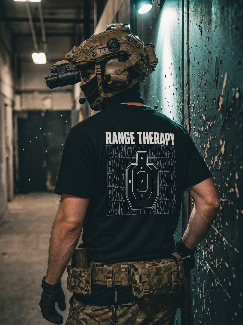 Man, wearing multicam pants, and tactical helmet with night vision, wears black Range Therapy text shirt, with professional shooting target graphic.