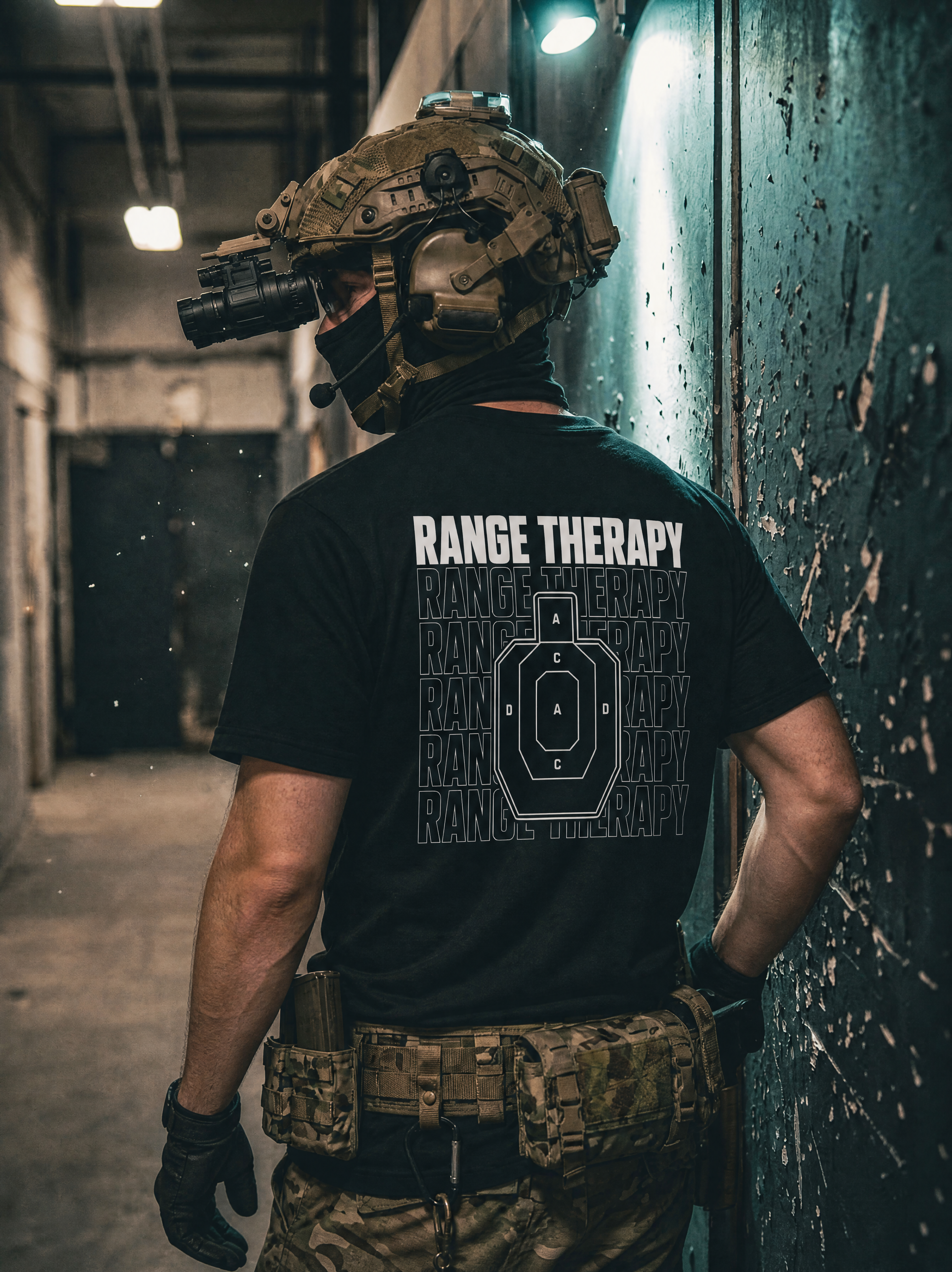 Man, wearing multicam pants, and tactical helmet with night vision, wears black Range Therapy text shirt, with professional shooting target graphic.