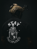 Person wearing a tactical helmet with a 'Stay Disciplined' skeleton graphic on a dark background