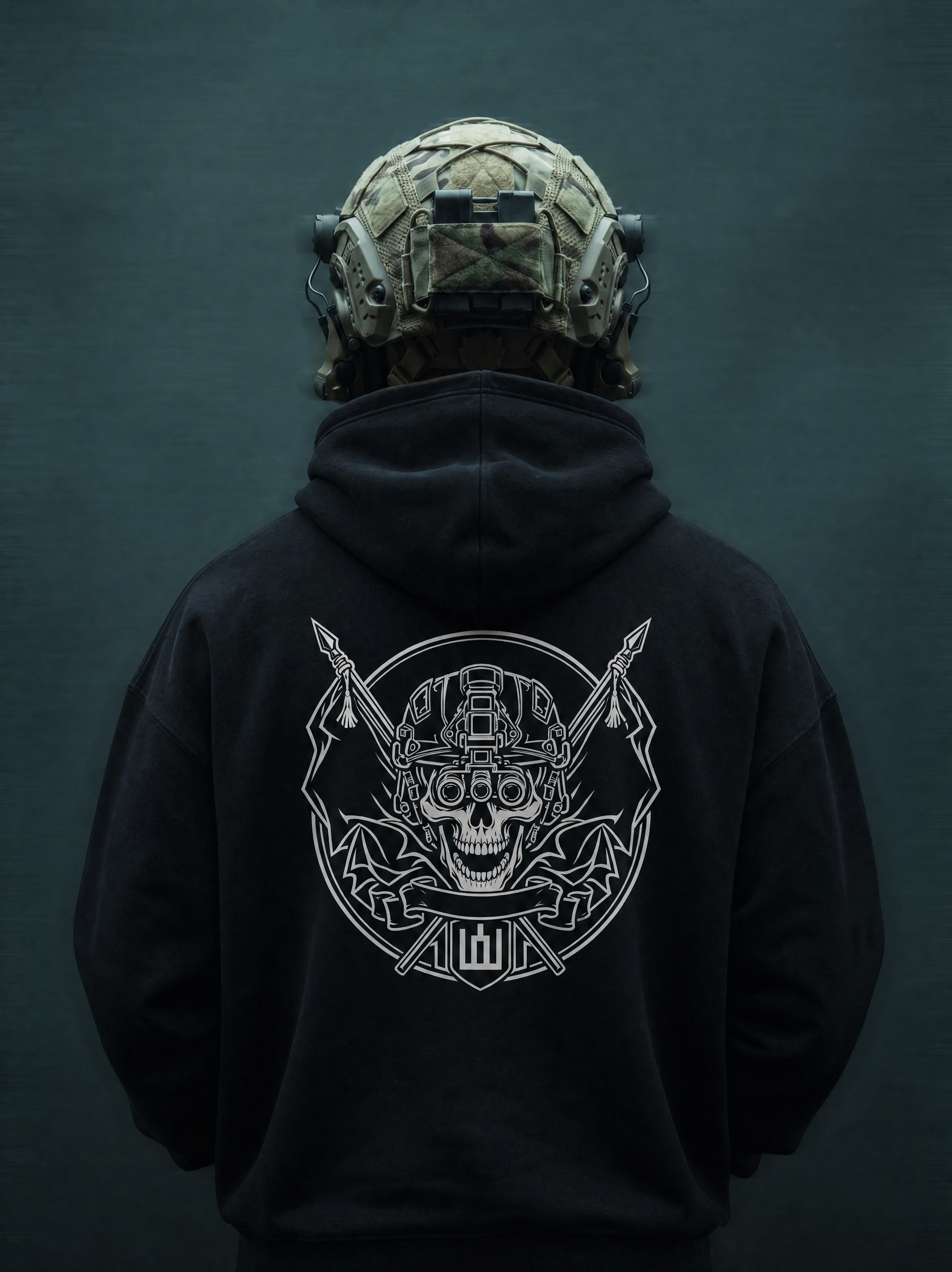 Person wearing a black hoodie with a white graphic design on the back, against a dark background.