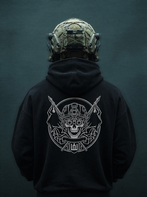 Person wearing a black hoodie with a white graphic design on the back, against a dark background.