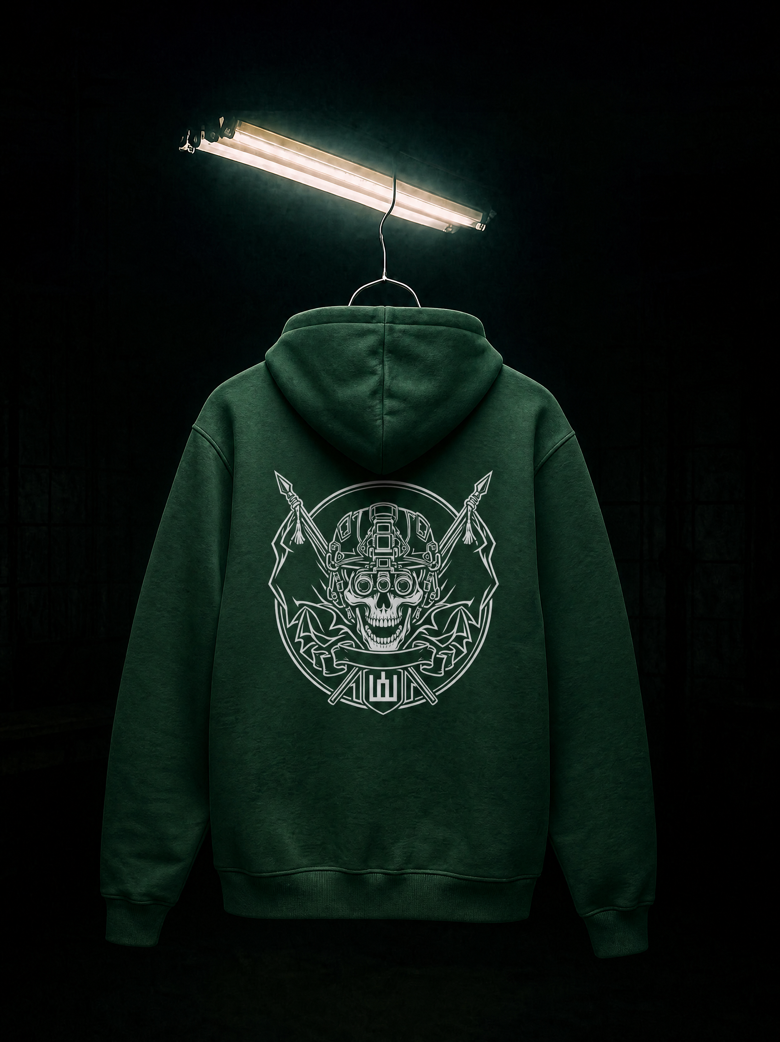 Green hoodie with a skull and crossbones design on the back, hanging against a black background.