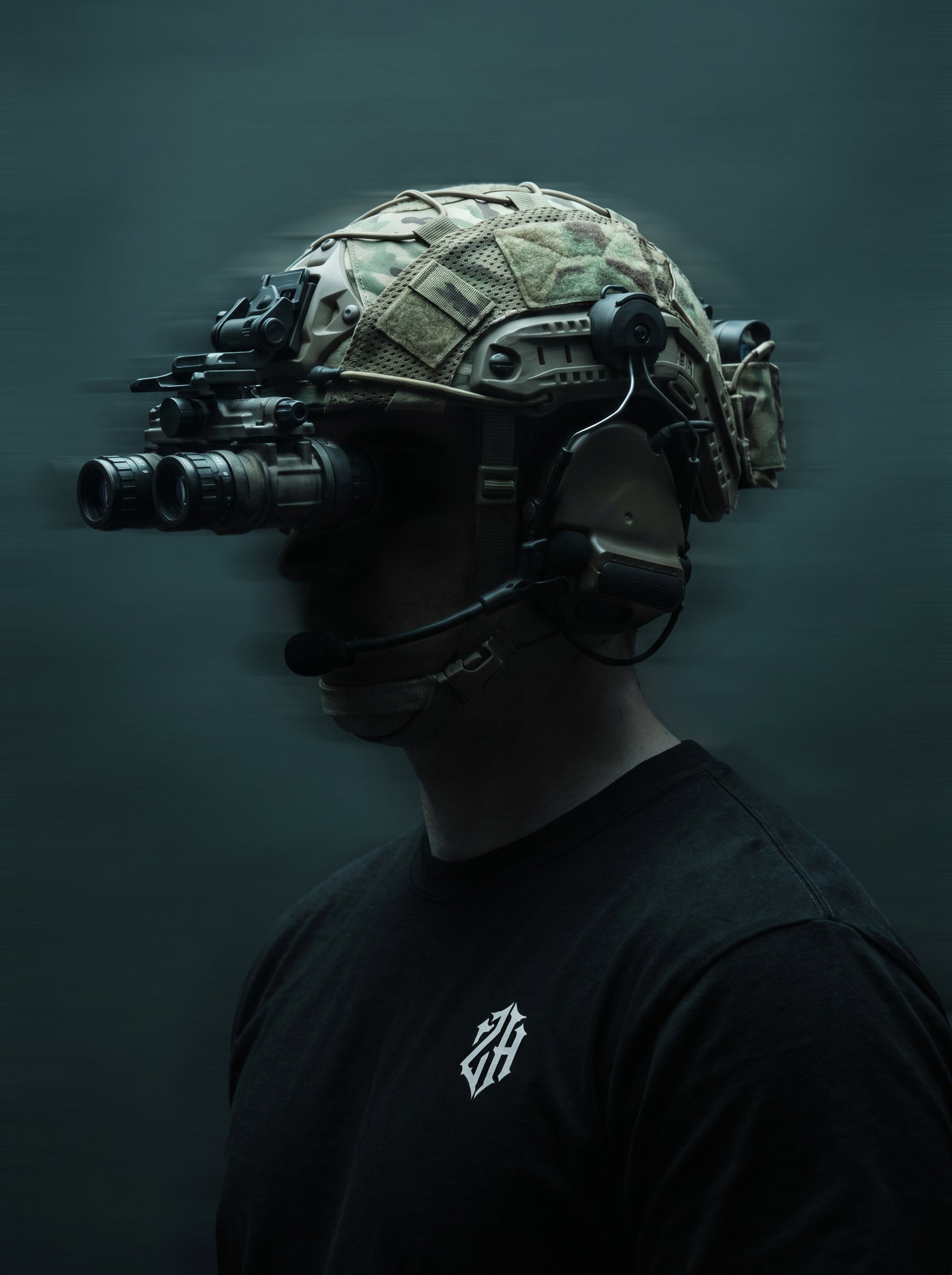 Person wearing a tactical helmet with night vision goggles on a dark background